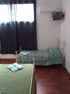 A bed or beds in a room at L'Albero bello Holiday