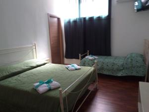 A bed or beds in a room at L'Albero bello Holiday
