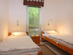 En eller flere senge i et værelse på Ferienwohnung Strandidyll, Trassenheide