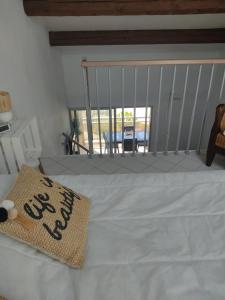 Ένα ή περισσότερα κρεβάτια σε δωμάτιο στο C'est la vie