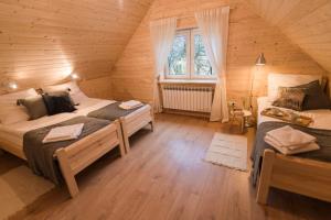 Кровать или кровати в номере Siedliska Samo Dobro