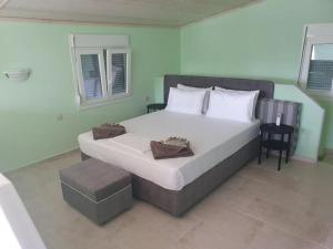 Postel nebo postele na pokoji v ubytování Makis Nest Apart-Hotel