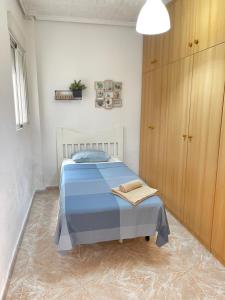 A bed or beds in a room at UIM Mediterraneo PB America Wifi