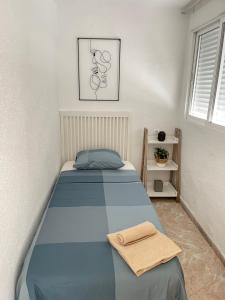 A bed or beds in a room at UIM Mediterraneo PB America Wifi
