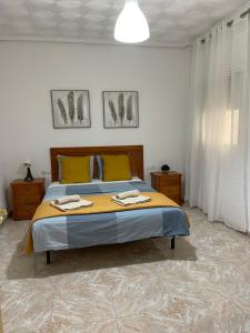 A bed or beds in a room at UIM Mediterraneo PB America Wifi