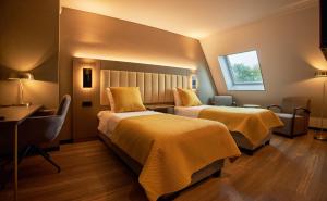 Postel nebo postele na pokoji v ubytování Hotel Hoogeveen