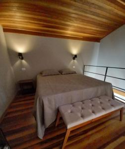 Cama ou camas em um quarto em Chalé Nova Suíça