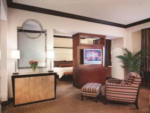 a hotel room with a suite with a bedroom at Ameristar Casino Hotel Vicksburg, Ms. in Vicksburg