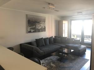 a living room with a couch and a table at Entire Apartment in Schieren - 2 Bedrooms in Schieren