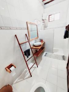 a bathroom with a sink and a mirror at Hakuna Matata Villa in Paje