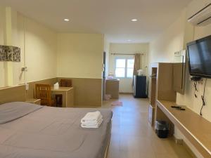 Baan Suan Palm Resort客房内的一张或多张床位