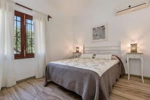 Postel nebo postele na pokoji v ubytování Villa Iris - Alcúdia