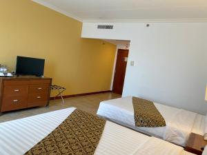 Postel nebo postele na pokoji v ubytování Days Hotel by Wyndham Iloilo