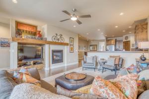 a living room with couches and a fireplace at Deschutes Landing at the Old Mill Riverfront - Meredith Lodging in Bend