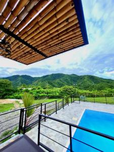 a view from the balcony of a house with a swimming pool at Villa Tokyo in Ibagué