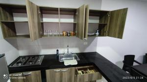 Kuchyň nebo kuchyňský kout v ubytování SANTYS HOUSE MELGAR apartamento amoblado para 6 personas