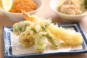 a plate of food with shrimp and other foods at Onyado Nono Matsumoto Natural Hot Spring in Matsumoto