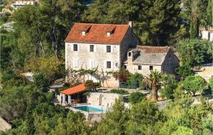 an aerial view of a house with a swimming pool at Holiday Home Bobovisca With Fireplace Xiv in Ložišće +32 photos