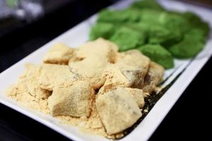 a plate of food with tofu and green vegetables at Onyado Nono Matsumoto Natural Hot Spring in Matsumoto