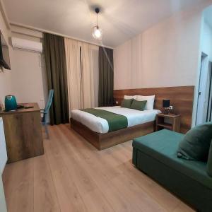 Postel nebo postele na pokoji v ubytování Hill Hotel