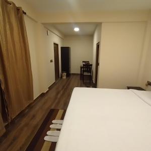 Postel nebo postele na pokoji v ubytování Joyous Rooms