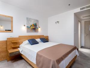 Ein Bett oder Betten in einem Zimmer der Unterkunft Hotel D'Elegant Dubrovnik