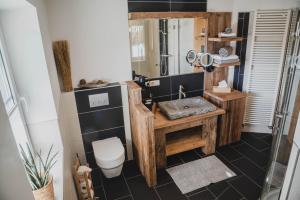 a bathroom with a sink and a toilet at Landhaus Theresia in Maria Alm am Steinernen Meer +44 photos