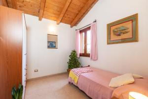 En eller flere senge i et værelse på Casa Orfea