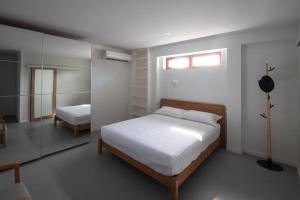 Postel nebo postele na pokoji v ubytování Nutnicha river house