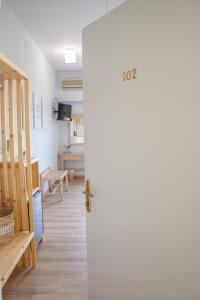 an open door to a room with a kitchen at Marabou Hotel Chorefto in Chorefto +40 photos