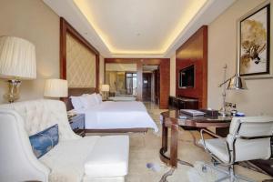 Ένα ή περισσότερα κρεβάτια σε δωμάτιο στο Days Hotel by Wyndham Logan City Huizhou