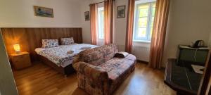 Posteľ alebo postele v izbe v ubytovaní Pension Pod Lipou