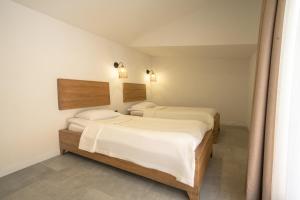 Postel nebo postele na pokoji v ubytování Zümrüt Çıralı Boutique Hotel