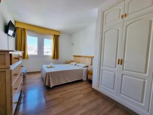 Posteľ alebo postele v izbe v ubytovaní G&G Isla Marina Puerto + 20 fotografií