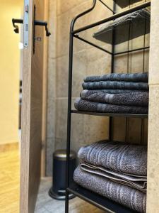 a towel rack with a bunch of towels at Villa Eximia Novigrad in Novigrad Dalmatia +32 photos