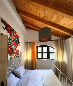 a bedroom with a large bed with a painting on the wall at Villa Eximia Novigrad in Novigrad Dalmatia