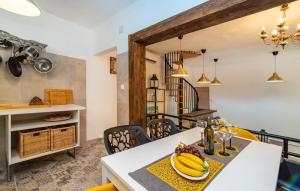 a kitchen and dining room with a table with bananas on it at Villa Eximia Novigrad in Novigrad Dalmatia