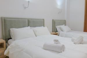 Postel nebo postele na pokoji v ubytování Villa Gjika
