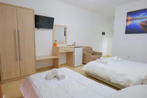 Postel nebo postele na pokoji v ubytování Villa Gjika