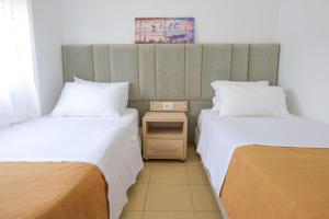 Postel nebo postele na pokoji v ubytování Villa Gjika