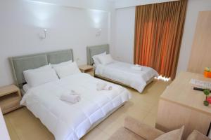 Postel nebo postele na pokoji v ubytování Villa Gjika