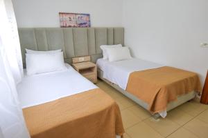 Postel nebo postele na pokoji v ubytování Villa Gjika