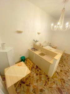 a kitchen with a sink and a counter at La Casa di Nonna Sisina in Mola di Bari