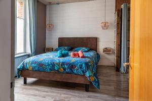 A bed or beds in a room at Ker Brunat centre historique idéalement situé cosy calme grand appartement