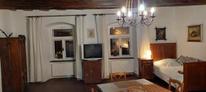 Posteľ alebo postele v izbe v ubytovaní Apartmány U sv. Floriána