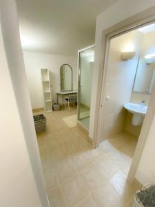 a bathroom with a sink and a mirror at La Casa di Nonna Sisina in Mola di Bari