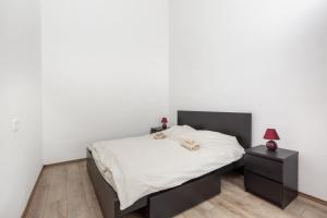 Posteľ alebo postele v izbe v ubytovaní D78 Dohány Apartment