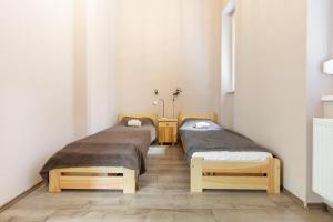Posteľ alebo postele v izbe v ubytovaní D78 Dohány Apartment