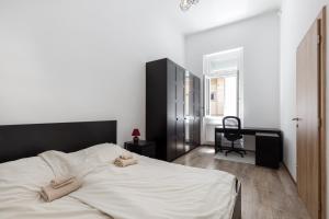 Posteľ alebo postele v izbe v ubytovaní D78 Dohány Apartment
