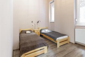 Posteľ alebo postele v izbe v ubytovaní D78 Dohány Apartment